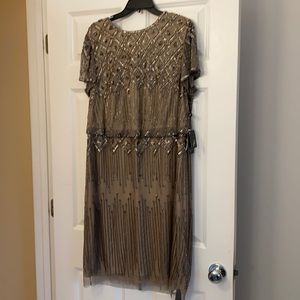 New tags on beaded formal knee length dress